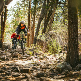 Two cyclists taking on Beechworth Mountain Bike Park's technical granite trails